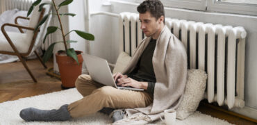 close-up-person-near-heater