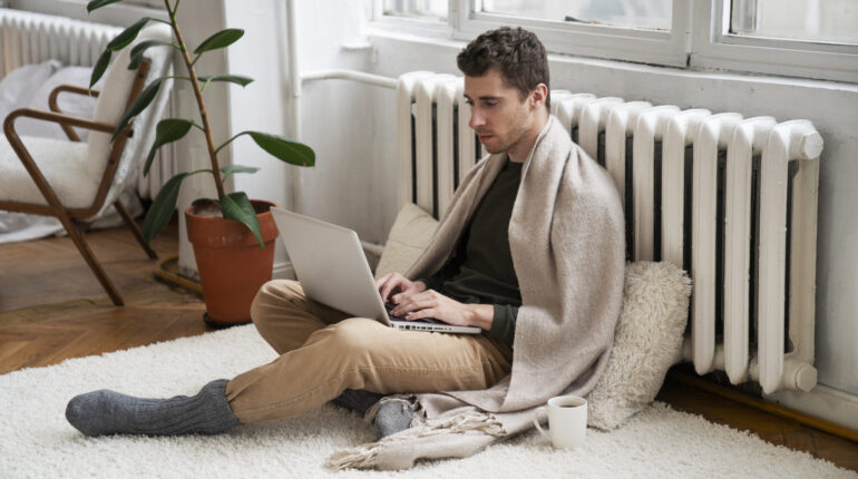 close-up-person-near-heater